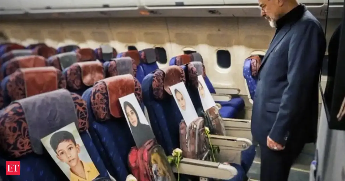 War victims' portraits, blood-soaked school bags: Iranian negotiator's companions on flight to Pakistan