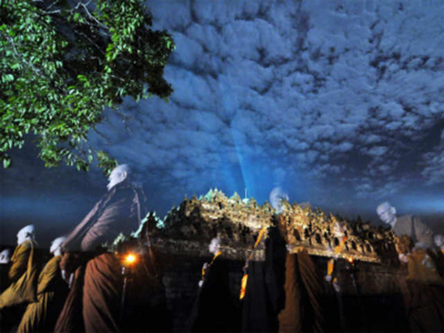 Indonesian Buddhist monks pray at Borobudur temple during Vesak festival
