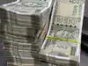 Rupee ends stronger, trims underperformance versus Asia FX on RBI measures