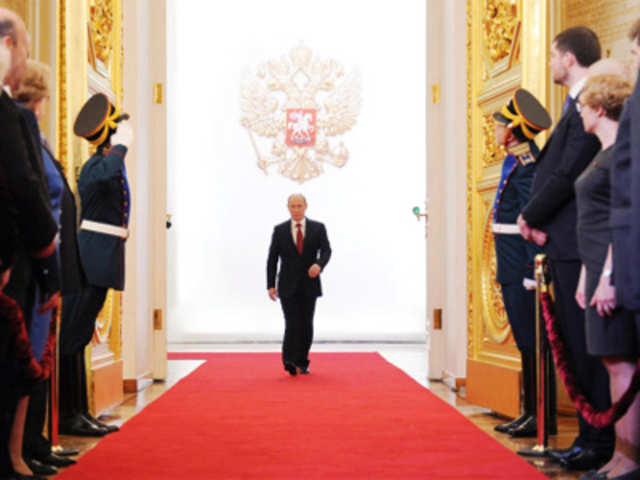 Vladimir Putin enters to take the oath of office