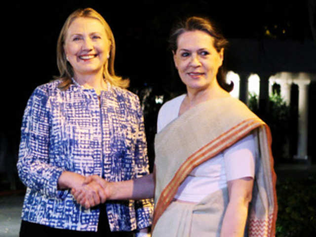 Hillary Clinton shake hands with Sonia Gandhi