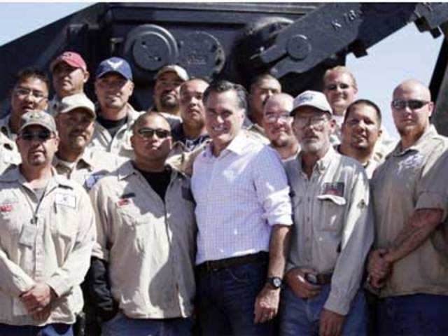 Mitt Romney poses with employees at KP Kauffman Co.