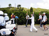 Alexander Loukos runs with the Olympic flame