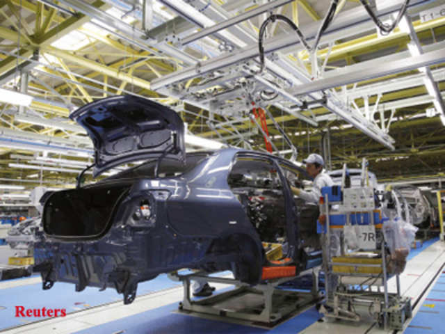 A worker assembles new Corolla vehicle