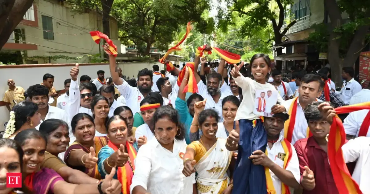 As TVK inches its way towards power, supporters gather outside party headquarters, celebrate