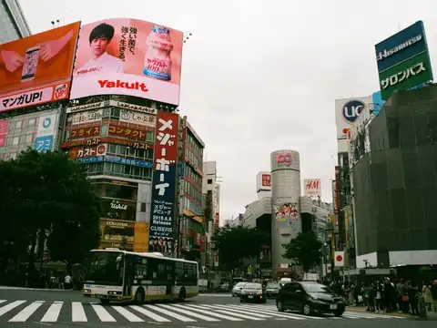 Stay in capsule hotels or manga cafes