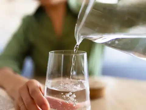 Drink water slowly throughout the day, not all at once