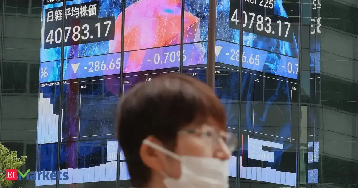 Japan’s Nikkei hits record high as chip-related shares jump