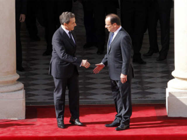 Nicolas Sarkozy welcomes Francois Hollande