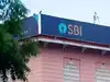 SBI pays Rs 8,813 crore dividend to government for FY26, FM Nirmala Sitharaman receives cheque
