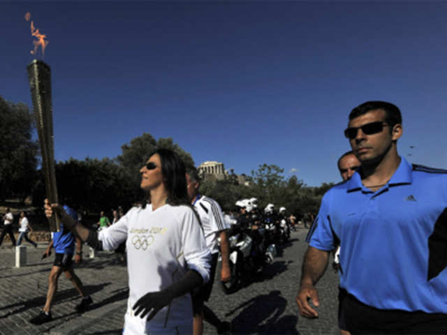 Dimitra Axelian runs with Olympic torch