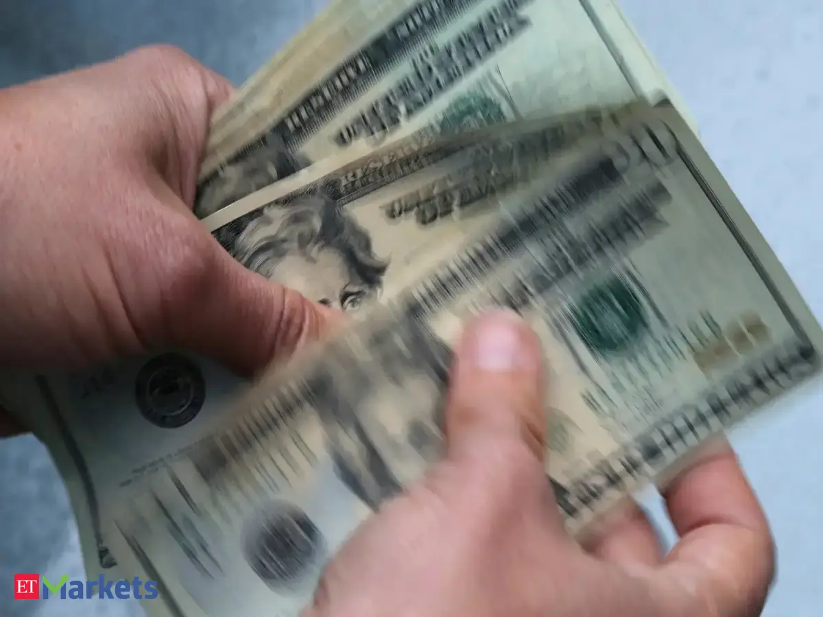 Dollar jumps as Fed holds rates but projects one hike later this year