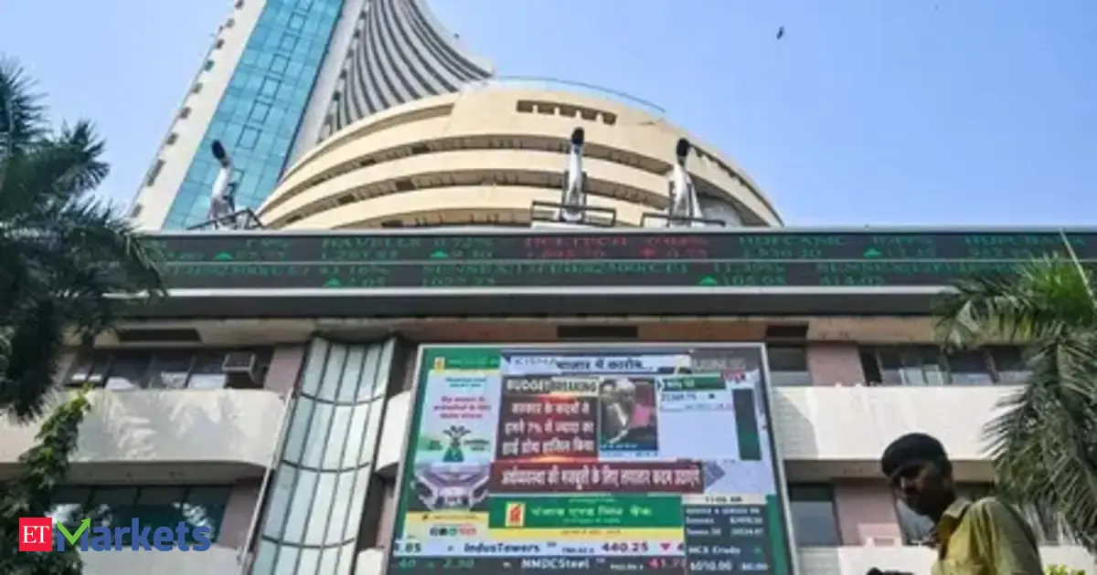 Stock market charts displaying a slight dip and a slight rise, symbolizing mixed performance of Indian indices on a Monday.