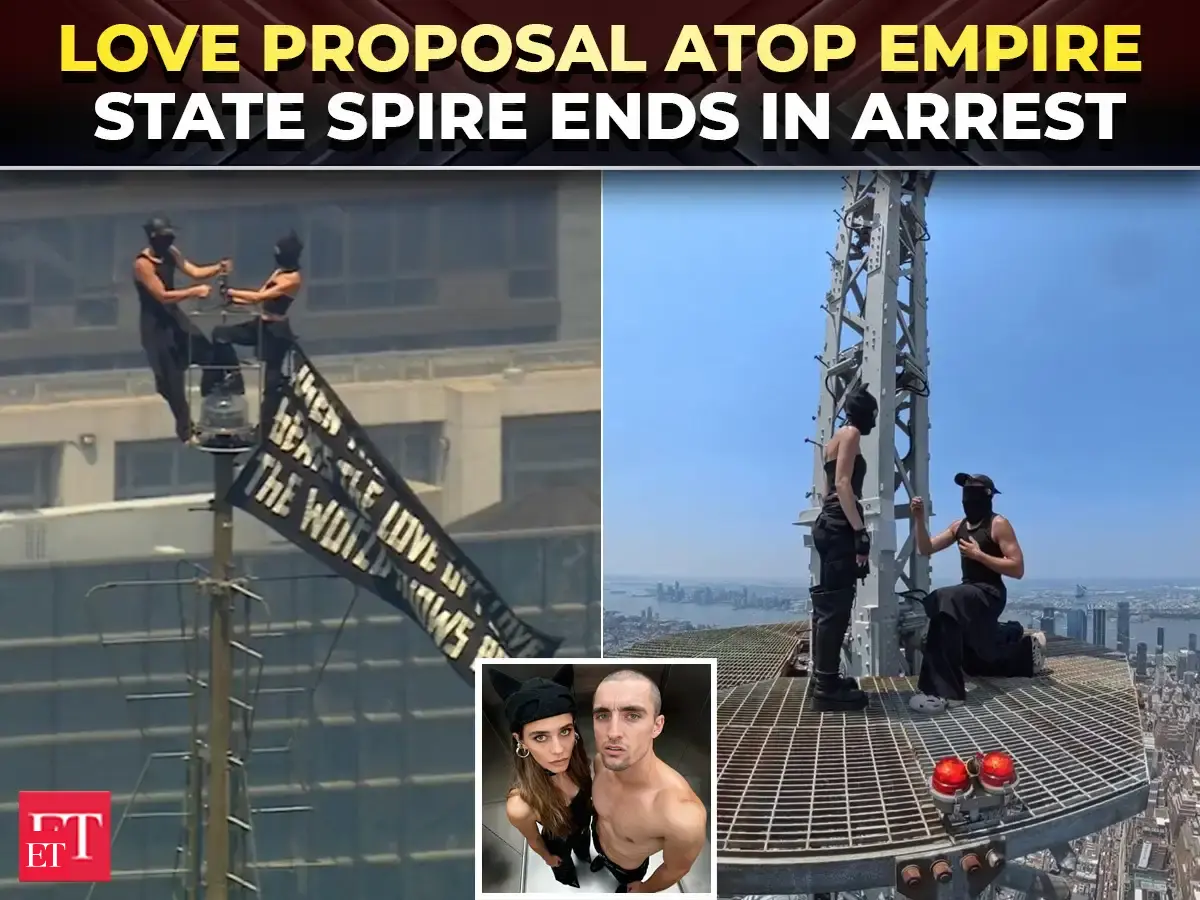 Couple climbs NYC Empire State spire, kisses, gets engaged, unfurls peace banner, ends in arrest