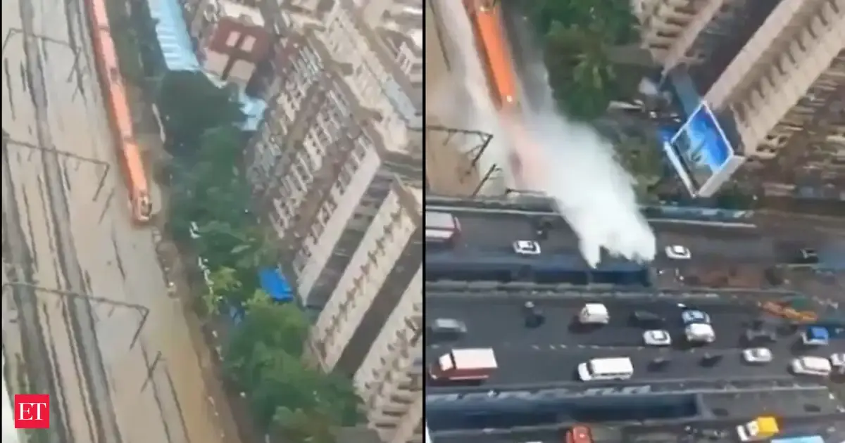 Amid Mumbai rains Vande Bharat seen running on tracks flooded water, splashing motorist on flyover above