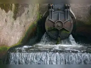 FILE PHOTO: Discharge is seen from an outlet pipe into the River Mersey near the United Utilities wastewater treatment plant in Stretford