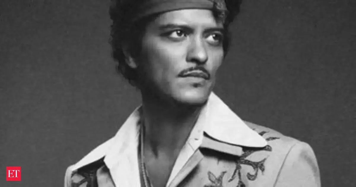 Quote of the day by Bruno Mars: 'You can't knock on opportunity's door and not be...' - motivational quote by Grammy-winning singer of Just the Way You Are, Uptown Funk and Die With a Smile teaches life lessons about preparation and taking action when you get an opportunity