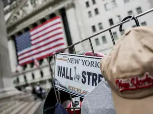 Who is funding America's widening debt with the rest of the world?