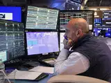 Stocks waver on Wall Street while crude oil prices fall for the first time in a week