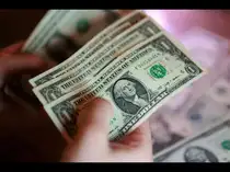 Illustration shows U.S. dollar banknotes