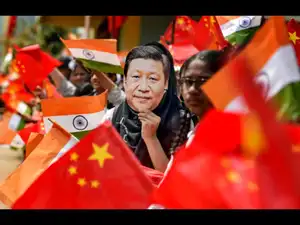 Chennai_ School students wave the national flag of China and India ahead of Chin