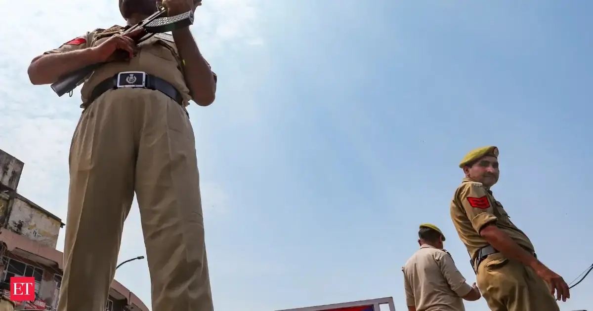 Jammu: Police personnel stand guard as part of heightened security arrangements ahead of the seventh anniversary of the abrogation of Article 370 and Article 35A, in Jammu.