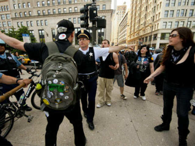Occupy Chicago demonstrators argue with Chicago Police officers