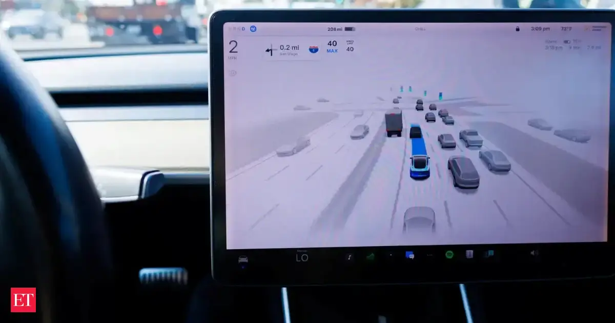A Tesla Model 3 vehicle drives using FSD (Full Self-Driving) in Encinitas, California, U.S.