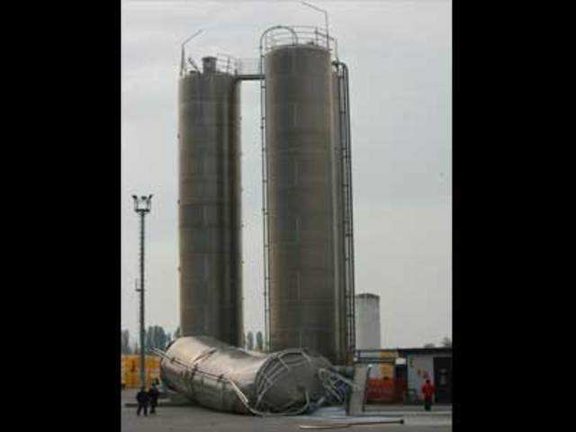 A silo lies on ground after falling during an earthquake