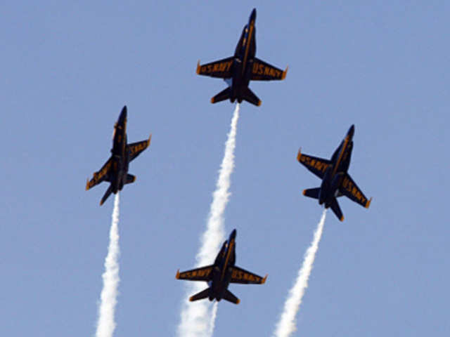 Members of the US Navy Blue Angels separate while performing