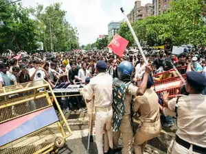 Congress MPs protested in the Parliament House complex  over alleged "police brutality" against student protesters during the agitation on the NEET paper leak issue
