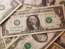 Illustration shows U.S. dollar banknotes