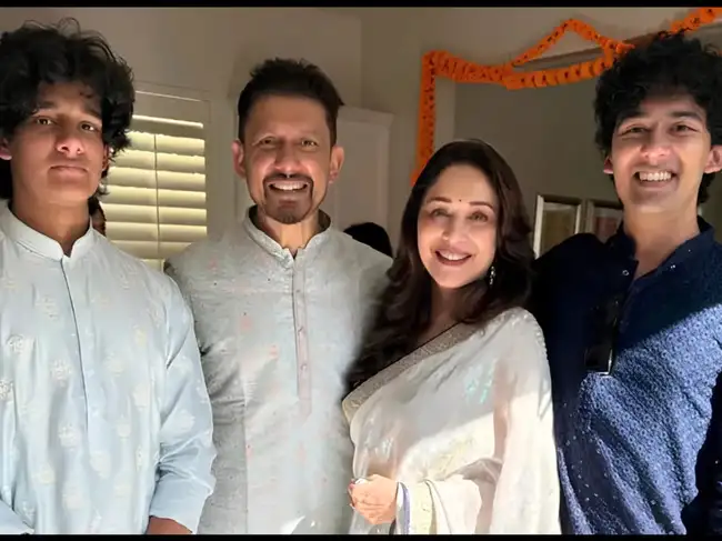Madhuri with her husband and two sons, Arin and Ryan Nene.