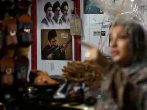 A picture of Iran's Supreme Leader, Mojtaba Khamenei, is displayed at a store in a local market in Bandar Abbas