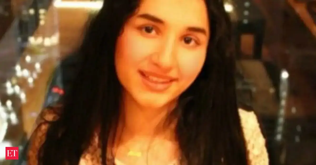 Aditi Paudel, Japan's first literacy ambassador, smiling with a book in hand.