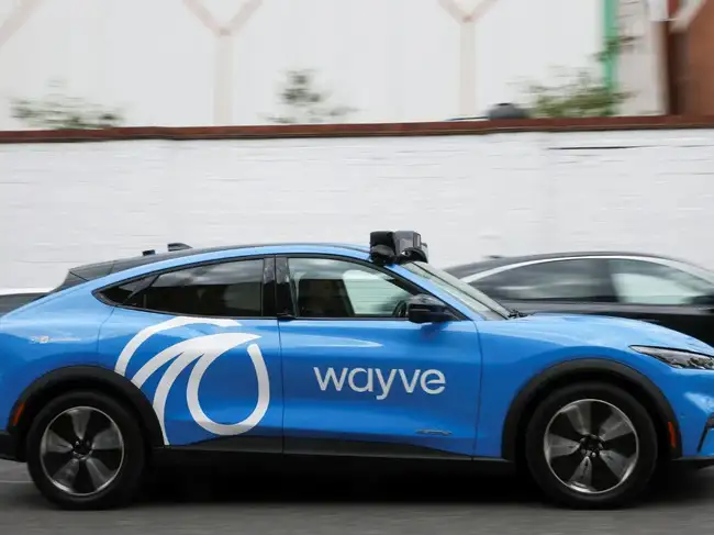 A Wayve autonomous car drives through a residential street during a technology demonstration in London