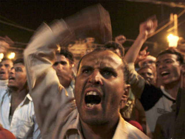 Anti-government protesters chant slogans during a protest