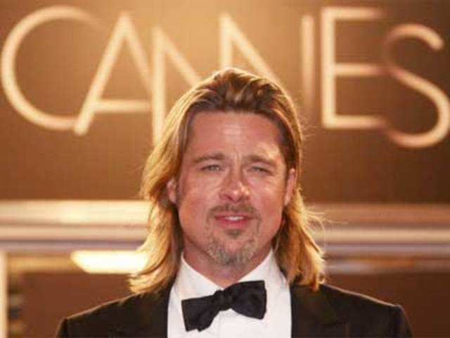 Brad Pitt poses at the 65th Cannes Film Festival