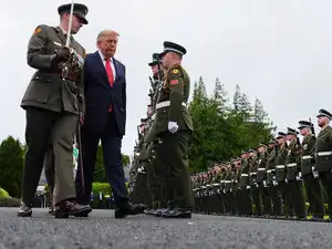 U.S. President Donald Trump, center, during a review of soldiers from the Guard of Honor during a visit with Ireland's President Catherine Connolly at &Aacute;ras an Uachtar&aacute;in in Dublin, Saturday, Sept. 12, 2026.