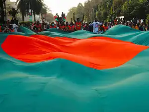 A Bangladesh tribunal sentenced former Prime Minister Sheikh Hasina and seven Awami League leaders to death in absentia for 2024 protest atrocities, drawing international trial concerns.