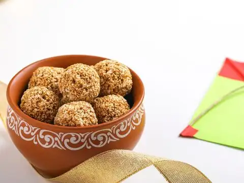 Til Laddoo Or Chikki In Place Of A Biscuit