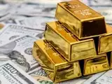 Gold rises slightly on lower oil prices, subdued dollar