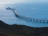 In 2018, China opened a crossing linking Hong Kong, Zhuhai and Macao with bridges and an undersea tunnel; the design avoided blocking major shipping lanes and airport flight paths