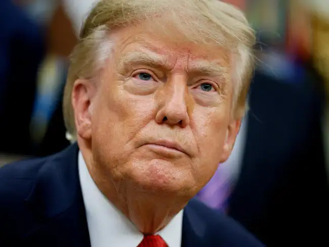 FILE PHOTO: US President Donald J. Trump looks on as he makes an announcement on healthcare in the Oval Office at the White House in Washington, D.C., US, September 18, 2026.