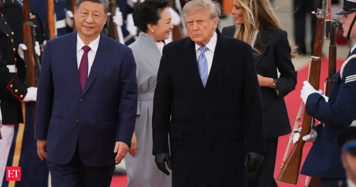 US President Donald Trump and first lady Melania Trump greet Chinese President Xi Jinping and his wife Peng Liyuan as they arrive at Joint Base Andrews, Md.