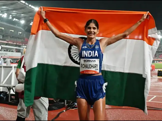 Nagoya [Japan], Sep 27: India's Parul Chaudhary holds the national flag as...
