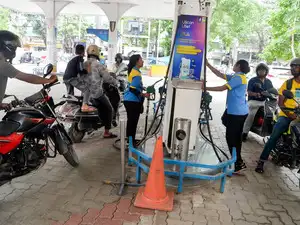Siliguri, May 23: People refuel their vehicles at a petrol pump following ...