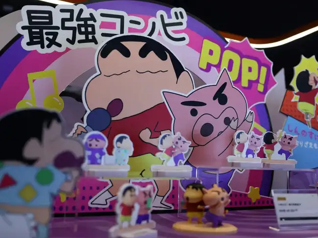 Toys from the Japanese animated series "Crayon Shin-chan" are on display at a booth outside a cinema, in Beijing
