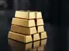 Gold slides to two-month low as robust dollar, yields add pressure