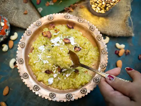 Garnish with nuts and serve warm